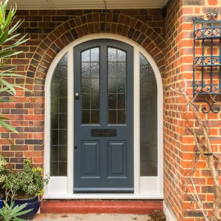 Deep Blue Arched Door for a Red-Brick Entrance
