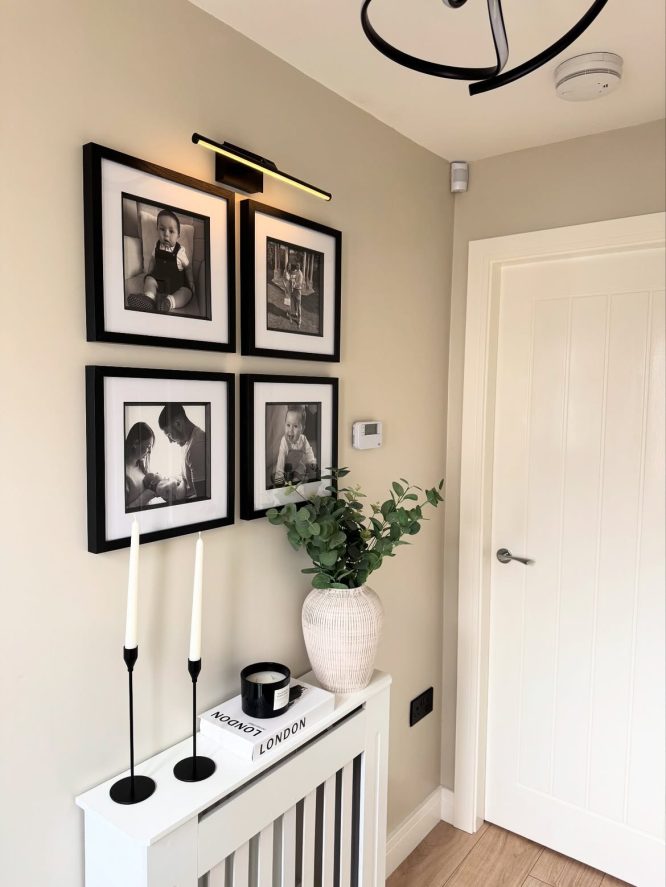 Photo Wall with Black Frames and Radiator