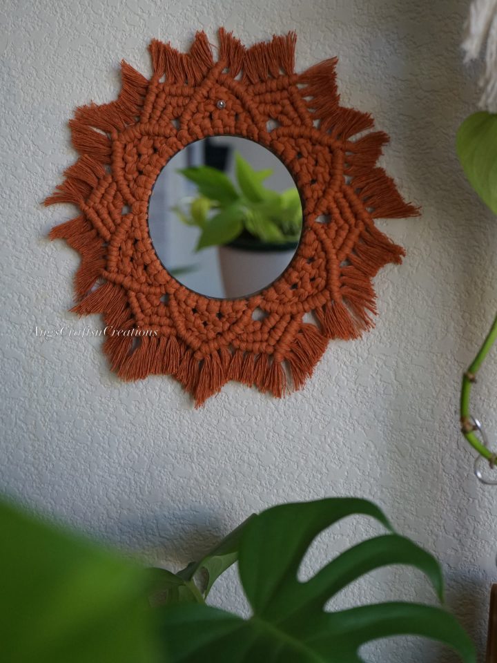 Round Mirror in Rust with a Sunburst Shape