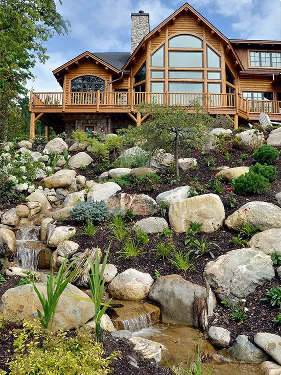 Rustic Waterfall Landscape Behind a Cabin