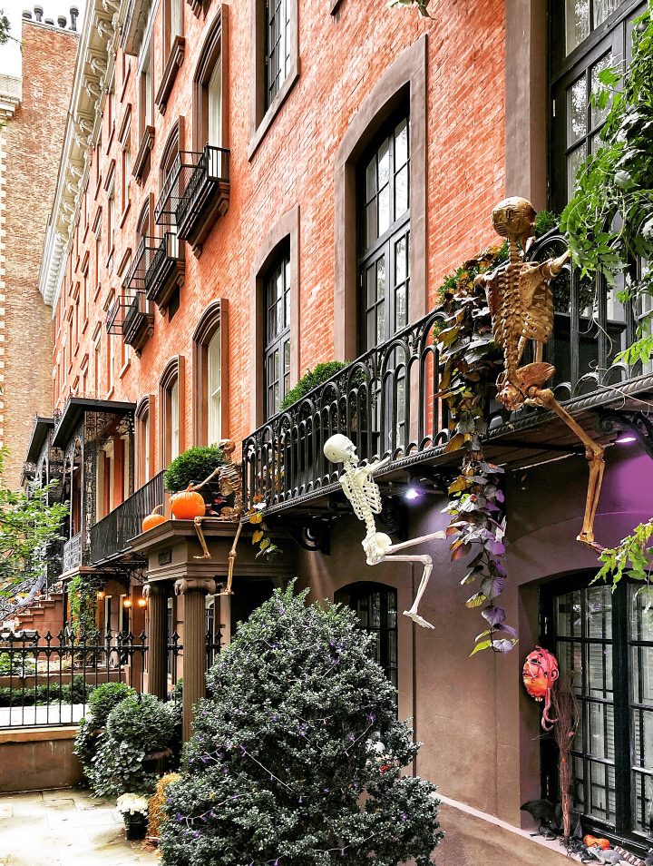 Skeleton Display on a Bronze Row House Balcony