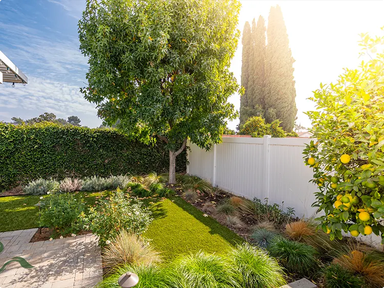 Straight Paver Edge Between Artificial Turf and Dry Garden