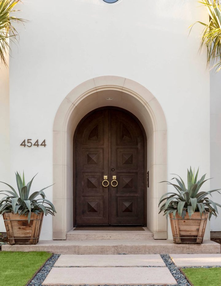 Two Dark Arched Wood Doors