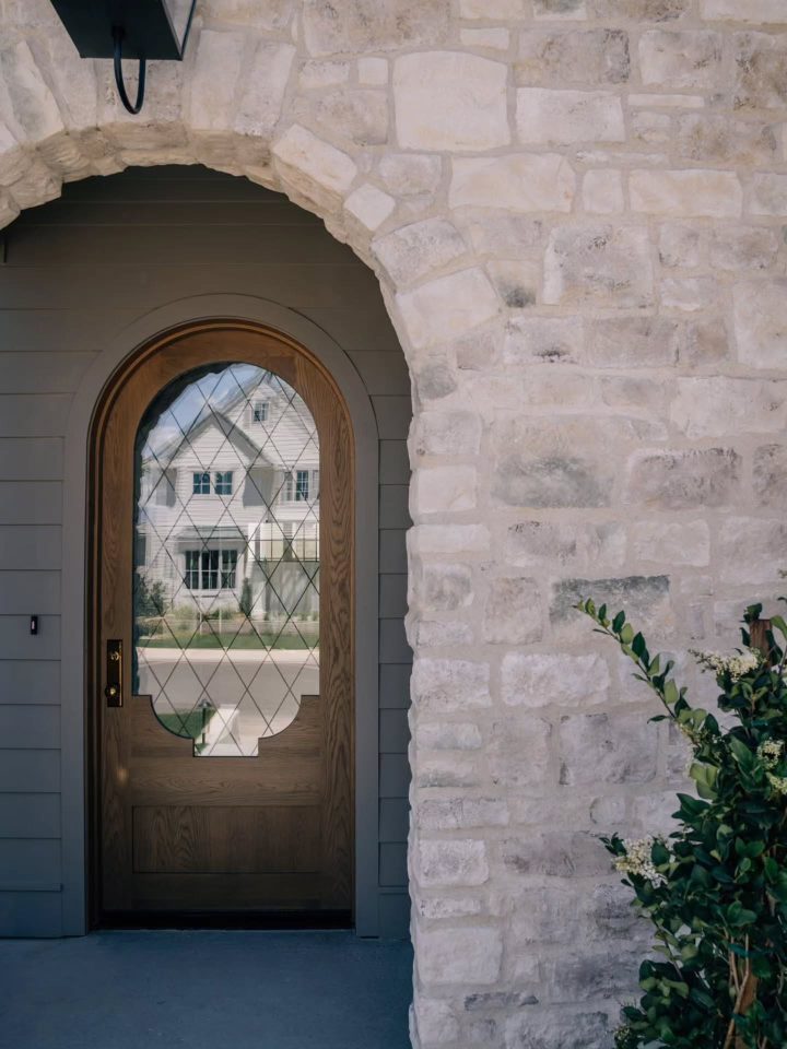 Whitewashed Stone Arch With Diamond Leaded Glass