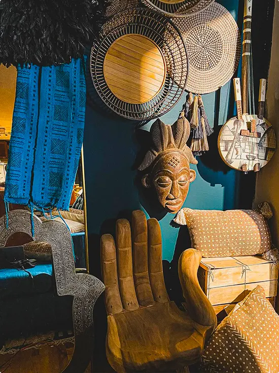 Corner Vignette with Woven Baskets, Teal Wall and Carved Mask