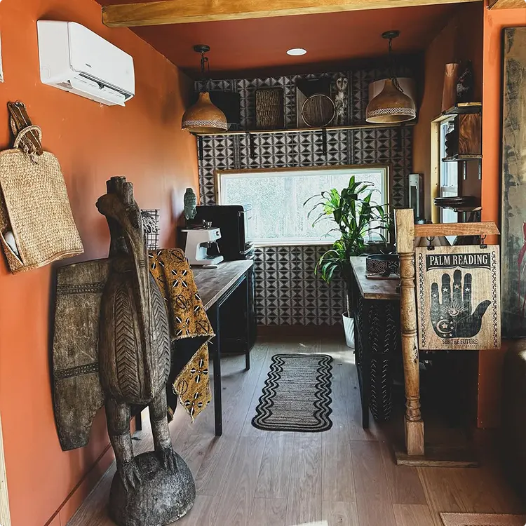 Geometric Tribal Wallpaper in a Narrow Terracotta Office
