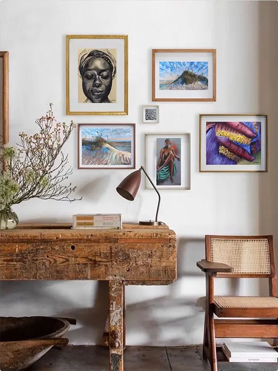 Rustic Wood Desk Beneath African-Inspired Gallery Wall