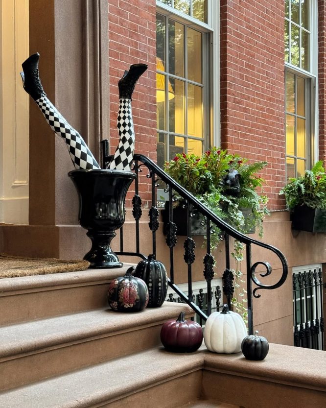 Black Urn with Two Upright Striped Witch Legs