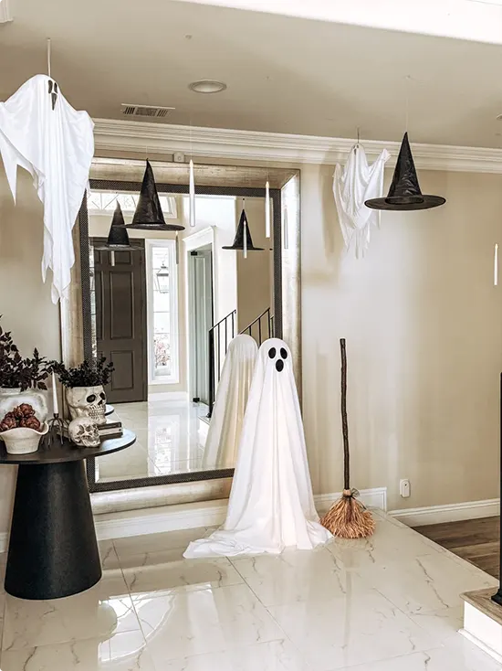 Floating Ghosts Above a Foyer Mirror
