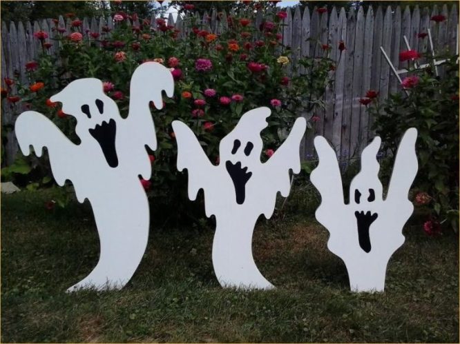 Ghost Trio on a Wooden Garden Fence