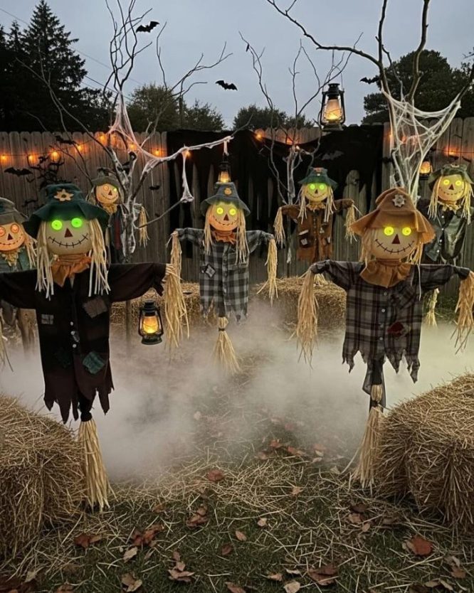 Row of Scarecrows with Glowing Green Eyes and Hay Bales