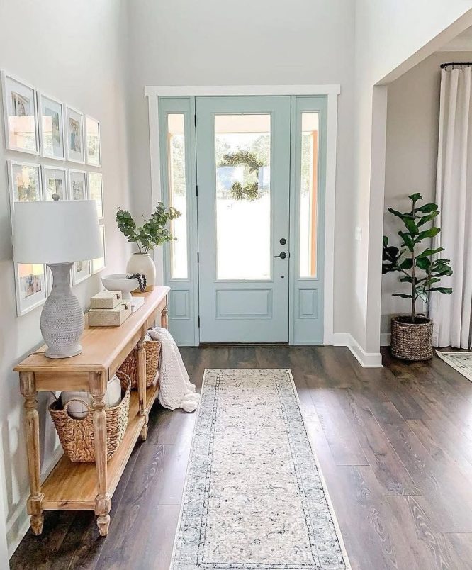 Soft Blue Entryway with Console and Gallery Wall