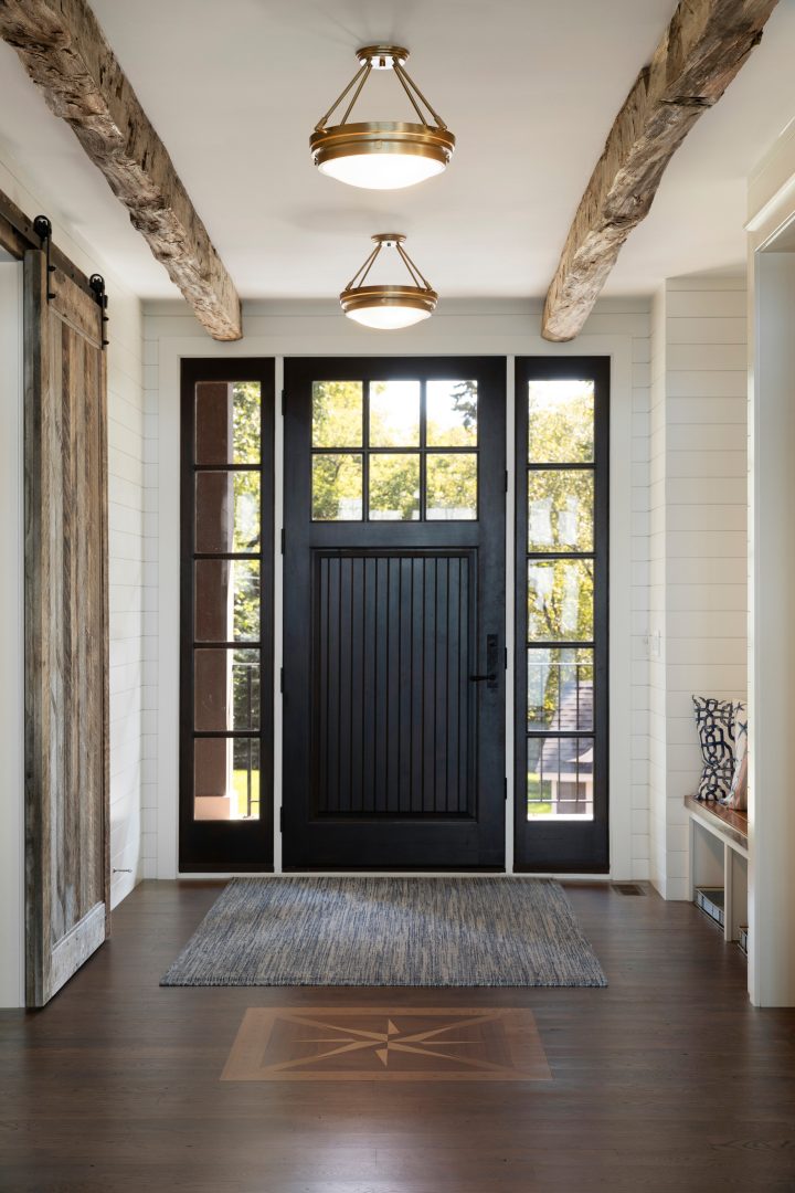 Black Front Door with Weathered Wood Beams