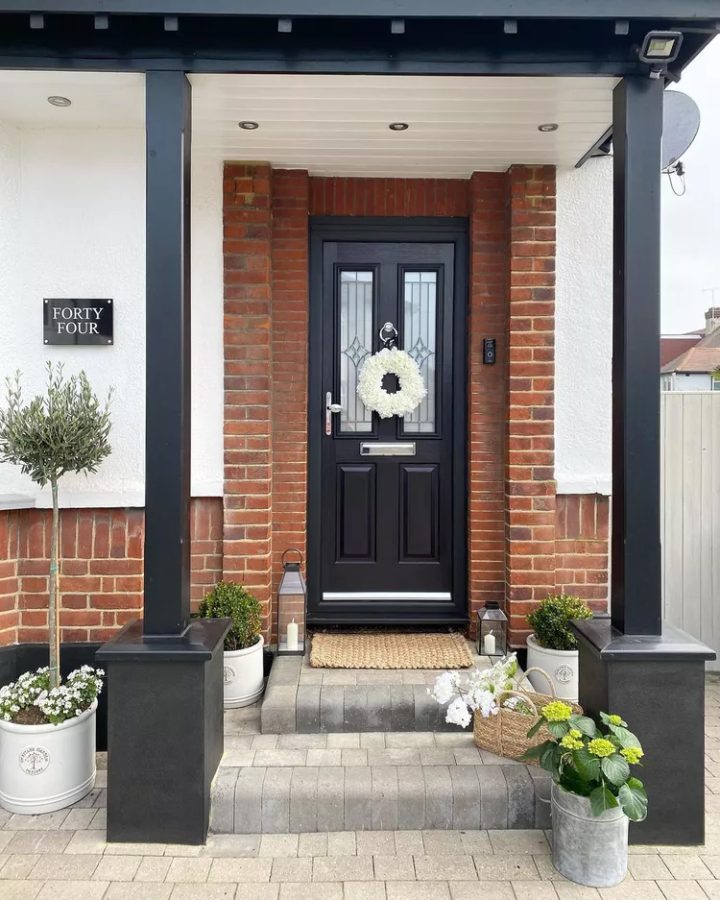 Composite black door with floral wreath